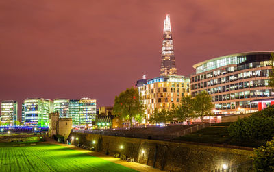 Illuminated buildings in city at night