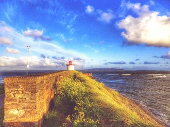 Scenic view of sea against cloudy sky