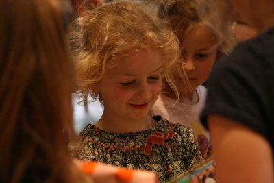 Portrait of smiling girl looking down