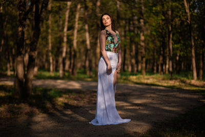 Portrait of woman standing in a forest