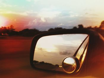 Reflection of sun on side-view mirror