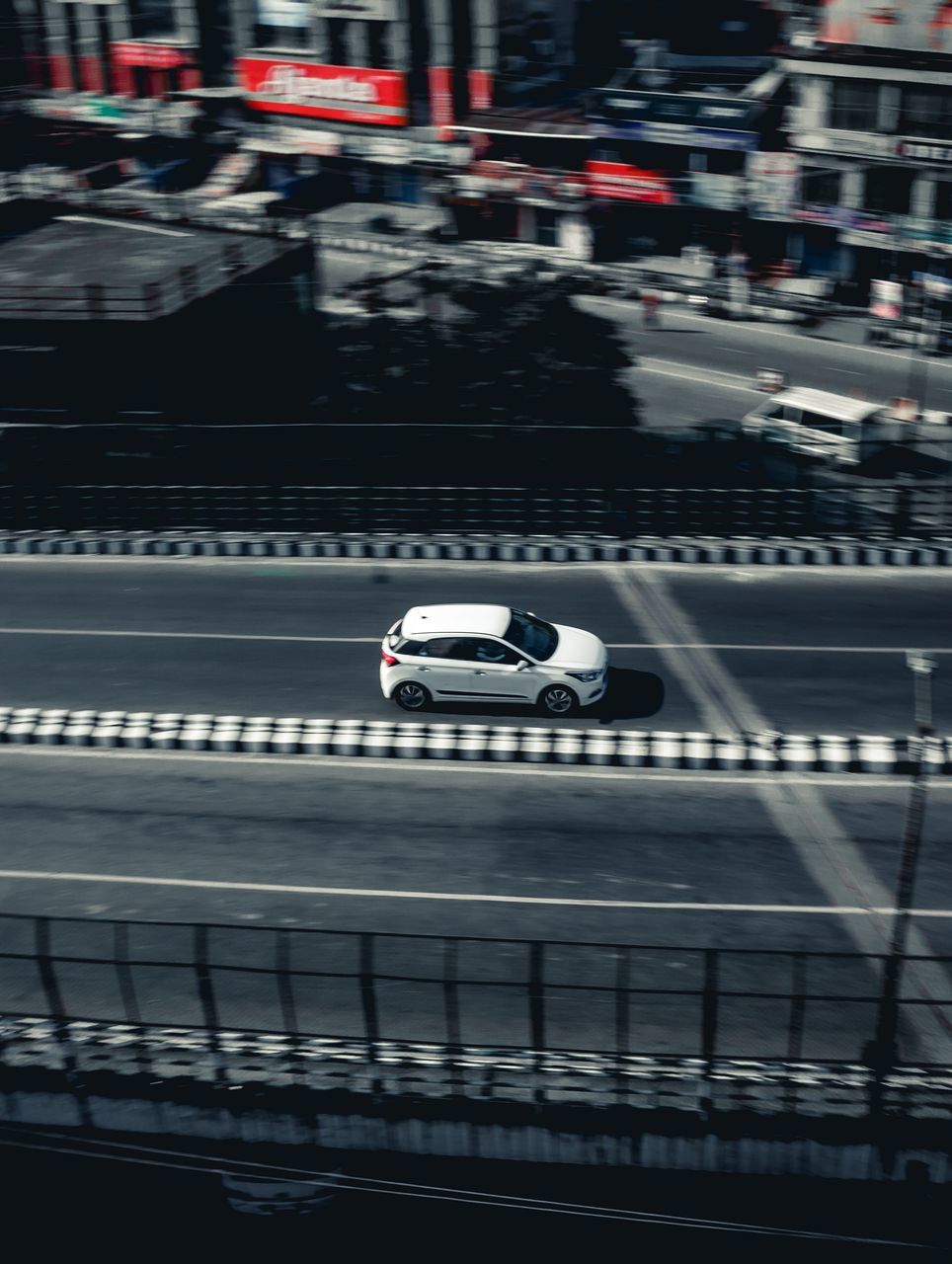 HIGH ANGLE VIEW OF VEHICLES ON ROAD