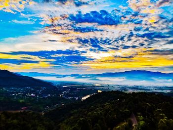 Scenic view of dramatic sky over landscape