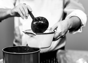 Close-up of man preparing food