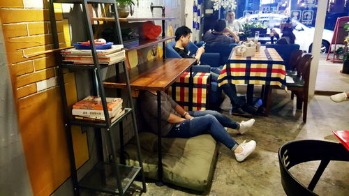Woman sitting in corridor