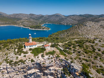 Scenic view of sea and buildings against sky
