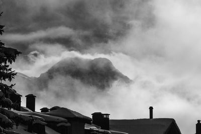 Low angle view of smoke emitting from clouds
