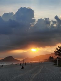 Scenic view of silhouette mountains against sky during sunset