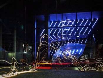 Illuminated light painting at night in city