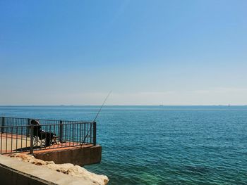 Scenic view of sea against clear blue sky