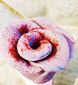 Close-up of hand holding strawberry