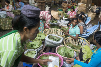 Venders selling betel leaves at market