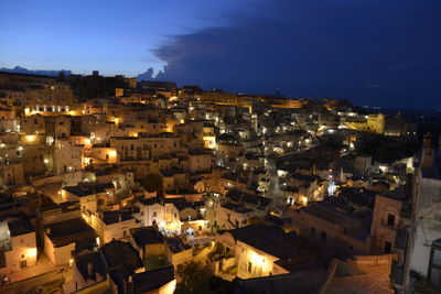 High angle view of illuminated townscape against sky at night