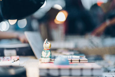 Close-up of figurine on office table