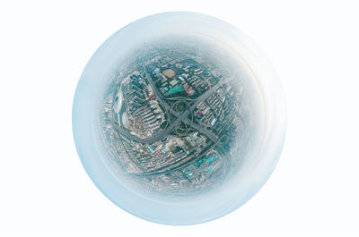 High angle view of crystal ball on white background