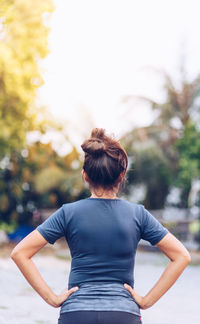 Rear view of woman standing outdoors