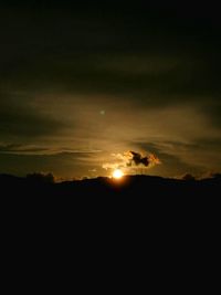 Scenic view of silhouette trees against sky during sunset