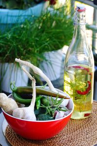 Close-up of plants in glass container on table