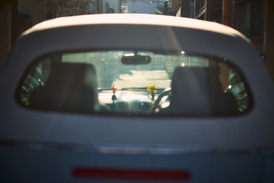 Reflection of car on side-view mirror