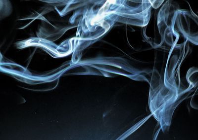 Close-up of smoke against black background