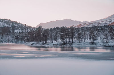 Scenic view of snowcapped mountains against clear sky