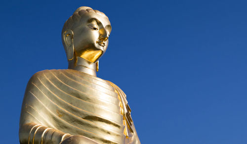 Low angle view of buddha statue