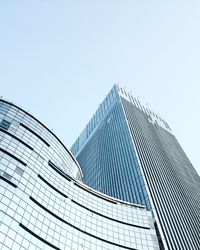 Low angle view of modern buildings against clear sky