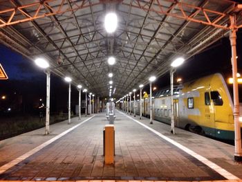 Railroad station platform at night