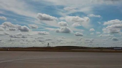 View of road against cloudy sky