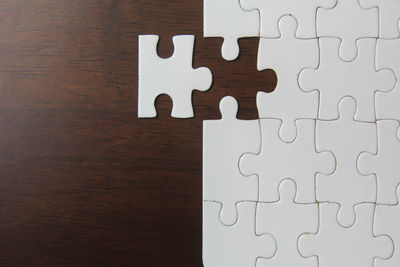 High angle view of arrow symbol on wooden table