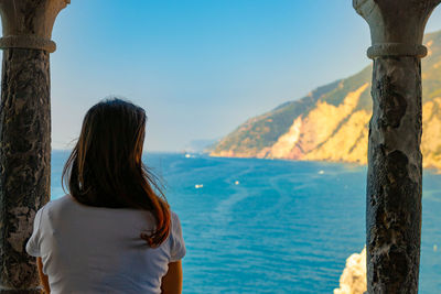 Rear view of woman looking at sea