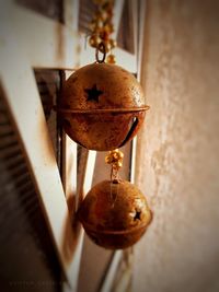 Close-up of illuminated electric lamp hanging on table