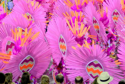 Rear view of people watching carnival on street