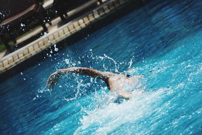 Woman swimming in pool