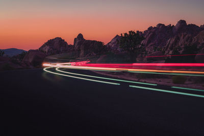 Car on road at sunset