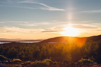 Scenic view of countryside landscape at sunset