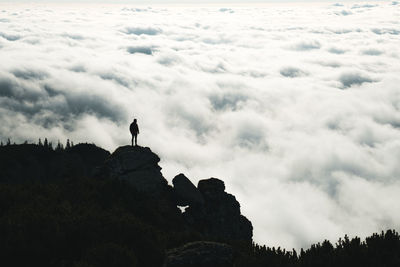 Low angle view of man on rock