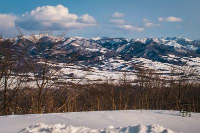 Scenic view of snowcapped mountains against sky