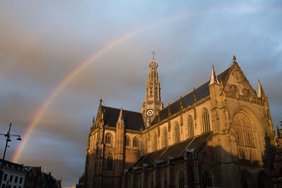 Low angle view of rainbow over building