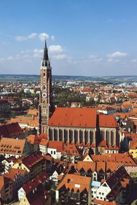 High angle view of cityscape against blue sky