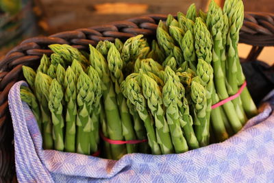 Close-up of asparagus in whicker basket