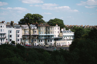 Buildings in town against sky