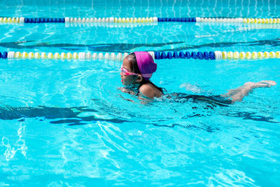 High angle view of girl swimming in pool