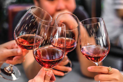 Cropped image of woman holding wine glass