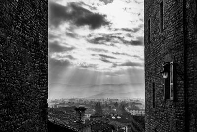 Buildings in city against sky