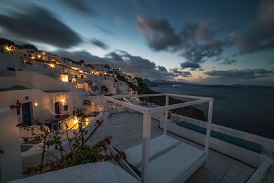 High angle view of houses in santorini by sea