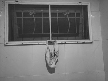 Portrait of woman seen through glass window