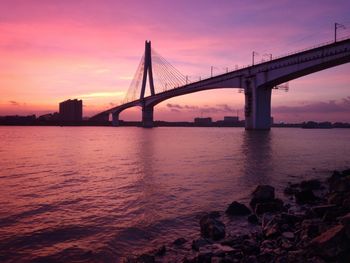 View of suspension bridge at sunset