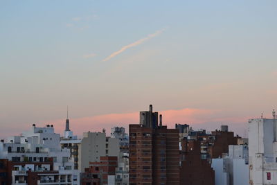 Buildings against sky during sunset