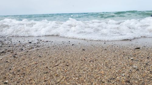 Surface level of beach against sky